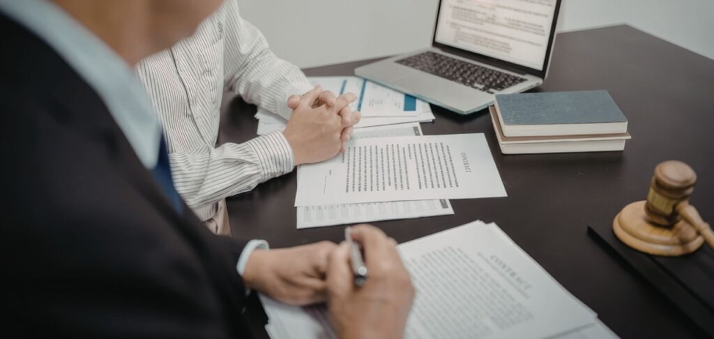 A photo of the real estate lawyers at West Legal in Calgary, Alberta working with clients on a new home build purchase